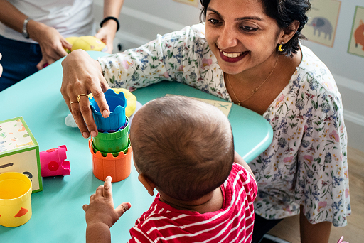 Teacher guiding preschool students with Cambridge Early Years curriculum in Malaysia classroom