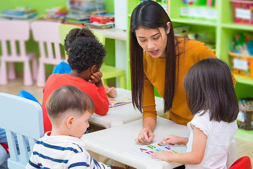 Teacher guiding kindergarten students with Cambridge Early Years curriculum in Kuala Lumpur