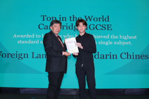 Cambridge curriculum graduate celebrating with certificate, symbolizing global opportunities and academic success.