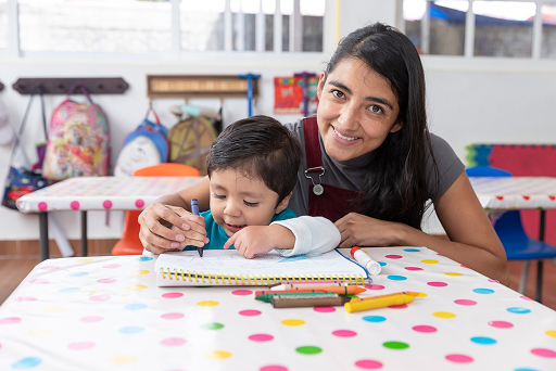 Dedicated kindergarten teacher providing individual attention at Regent International School Malaysia